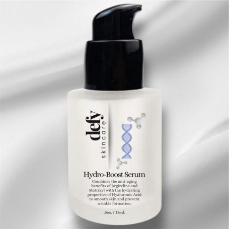 Hydro-Boost Serum in a clear bottle with a black pump on a grey background.